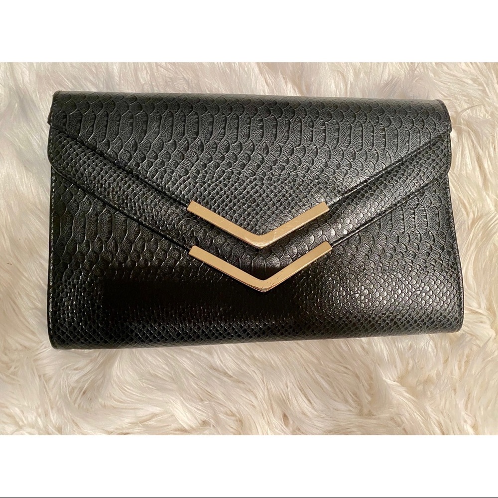 Elegant black clutch with strap